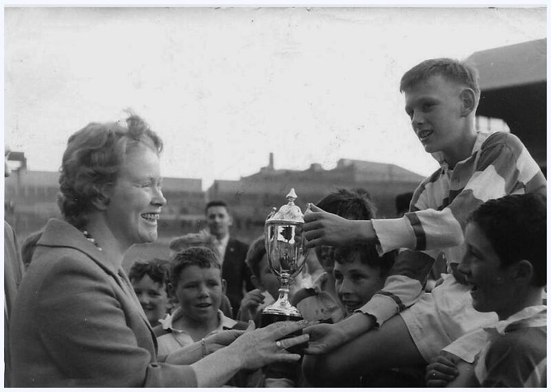 Neil O’Donoghue collects the trophy after captaining Round Towers under-13s to victory in the South County League/Paddy Barrett Cup competition, played in Croke Park in 1965