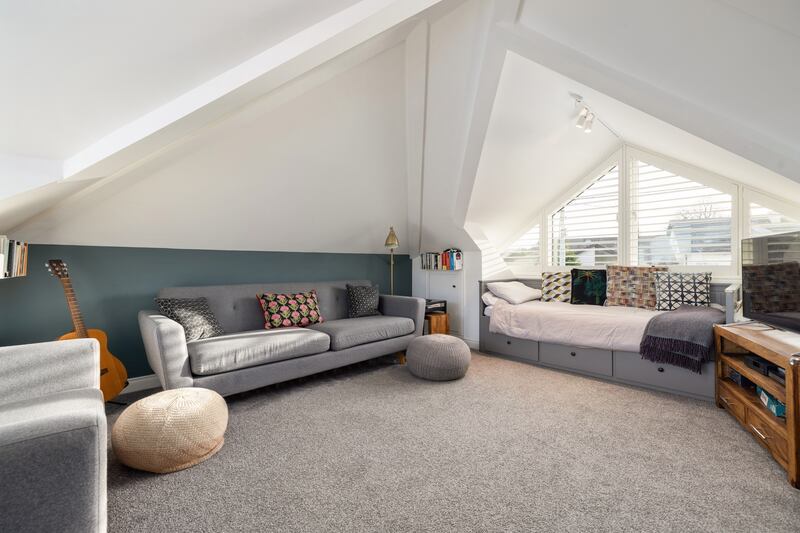 Upstairs living area with dual-aspect windows. Photograph: Andrew Nolan