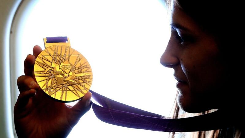 Katie Taylor with her Olympic gold medal from the 2012 Games. Photograph: Dan Sheridan/Inpho