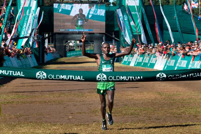 Kenya's Justin Kemboi Chesire raises his arms as he crosses the finish line, winning the men's section of the Two Oceans ultra-marathon, on March 31st, 2018, in Cape Town. This is the 49th edition of the race, which is over 56km, and comes close to both the Indian and Atlantic oceans, hence it's name. Photograph: Rodger Bosch/AFP/Getty Images