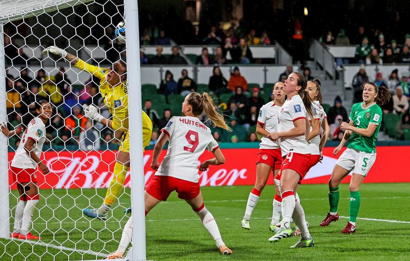 Ireland’s Katie McCabe scores the opening goal directly from a corner kick despite Canada goalkeeper Kailen Sheridan's attempts to save. Photograph: Ryan Byrne/Inpho