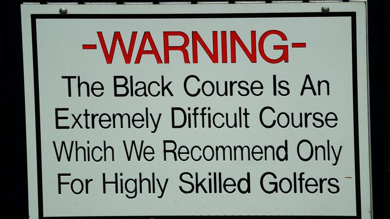 The famous warning sign behind the first tee. Photo: Mike Ehrmann/Getty Images