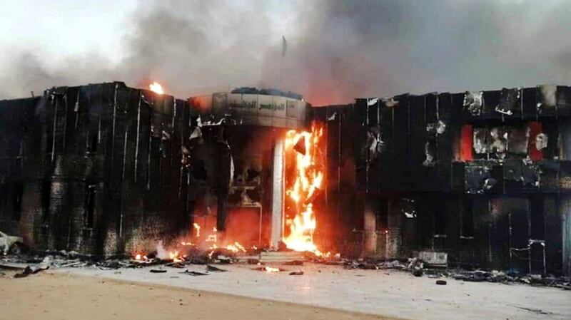 Protesters set fire to the ruling party headquarters, in Atbara, Sudan. The protests were initially sparked by rising prices and shortages, but soon turned to demands for president Omar al-Bashir to step down. Photograph: Sudanese activist via AP