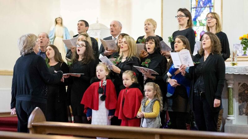 Arlene Harris singing with Barefield Church Choir under the direction of Breda Loughnane with Organist Sarah Ferrigan at Barefield Church this week. Photograph: Eamon Ward