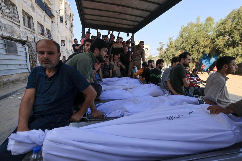 Mourners gather around the shrouded bodies of members of the Agha family, killed in an Israeli strike in Khan Yunis in the Gaza Strip, during their funeral on Saturday. Photograph: Mahmud Hams/AFP via Getty Images