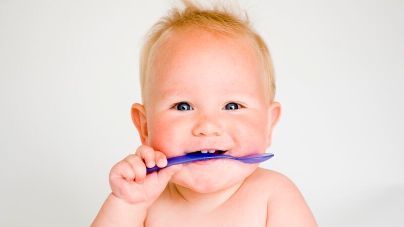 At six months old your baby explores the world not just with their hands but with their mouth. Photograph: iStock