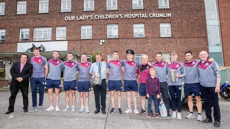 Members of the All-Ireland-winning minor and senior Galway teams with RTÉ’s Marty Morrissey on their visit to  Our Lady’s Children’s Hospital Crumlin, Dublin. Photograph: Oisín Keniry/Inpho