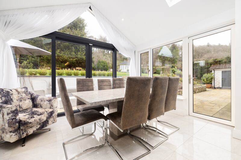 A dining area to the back has large rooflights overhead, with doors opening on to a paved terrace, perfect for al fresco dining. Photograph: Andrew Nolan Photography