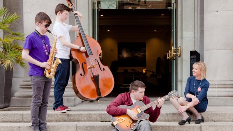Jazz Trio from the Errigal Groove Orchestra, featuring twins Conor (double bass) and Micheál Murray (saxophone) and Emmet Doherty, (guitar), with Rosaleen Molloy, director of Music Generation
