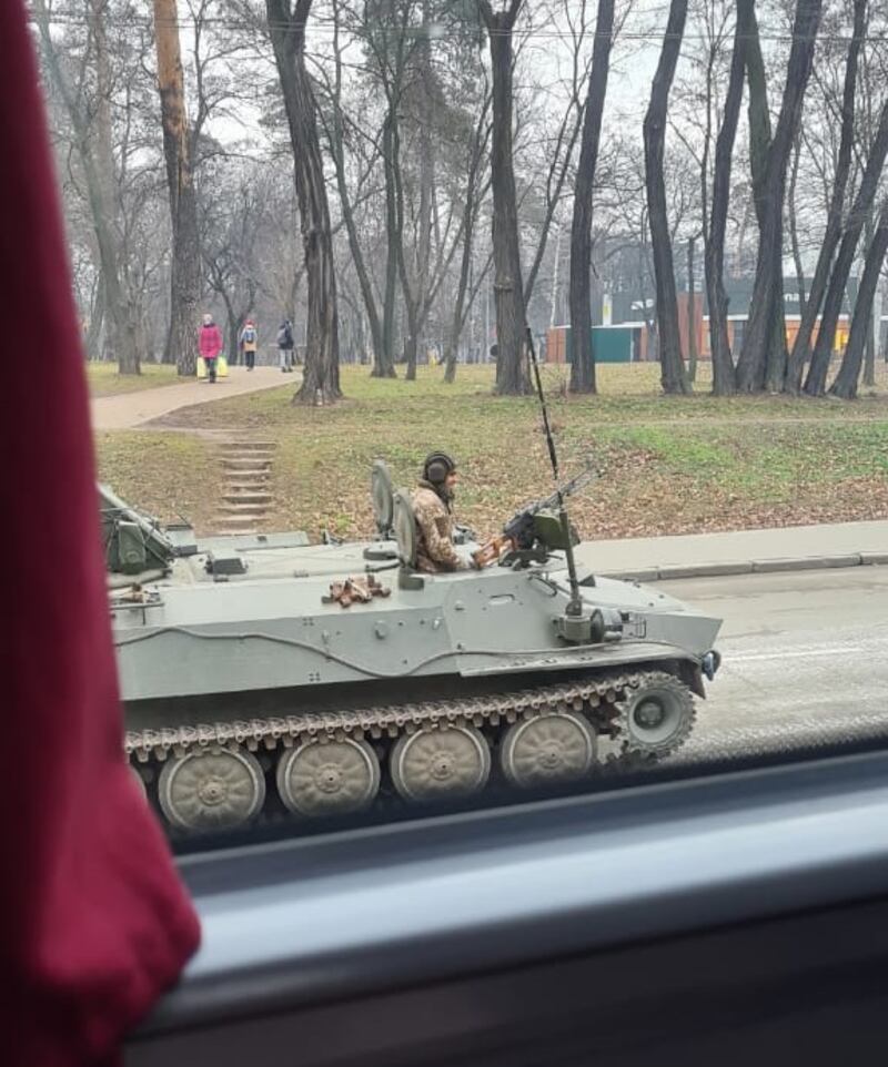 Tanks driving alongside the bus, photographed by Mr Flanagan and Ms Farbun on their way to Poland