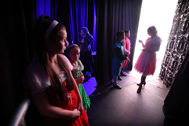 Chloe Kinch (right) speaks to Conor O'Brien and Callum Lennon as they and fellow performers prepare to go on stage at the National Stadium in Dublin for Beauty and the Beast. Photograph: Bryan O’Brien