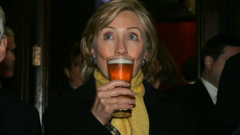 Hillary Clinton enjoys a beer at McDaid’s Pub on Harry Street, Dublin in 2009. Photograph: Cyril Byrne