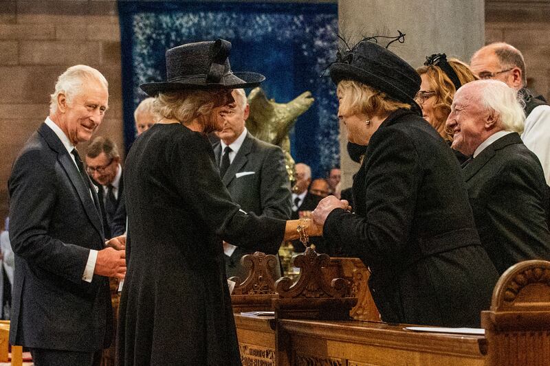 Britain's King Charles III looks on as queen consort Camilla speaks with President Michael D Higgins and his wife Sabina at a Service of Reflection on the life of Queen Elizabeth at St Anne's Cathedral in Belfast. Photograph: Liam McBurney/POOL/AFP/Getty