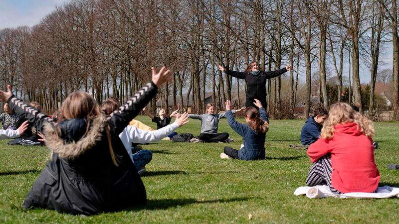 Teacher Rebekka Hjorth has music lessons with her class outdoors at the Korshoejskolen in Randers, Denmark. Photograph: Bo Amstrup/EPA