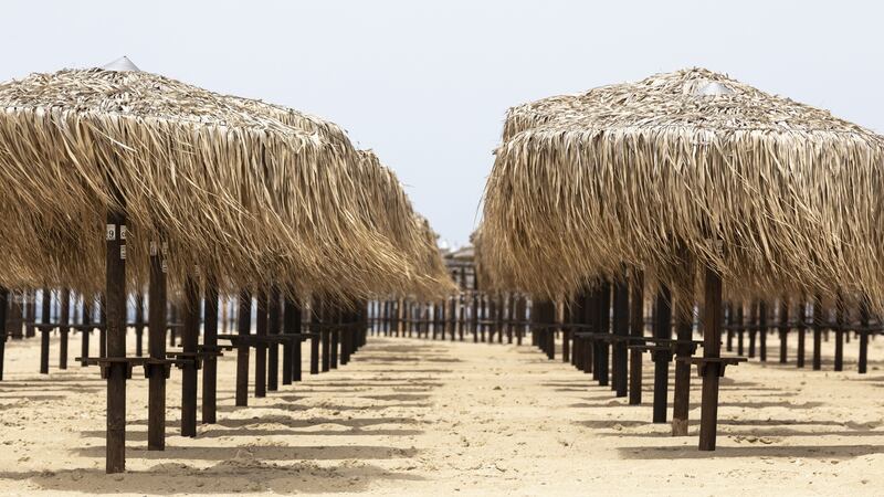 Parasols at a closed beach bar in Nea Iraklia, Halkidiki. Photograph: Konstantinos Tsakalidis/Bloomberg