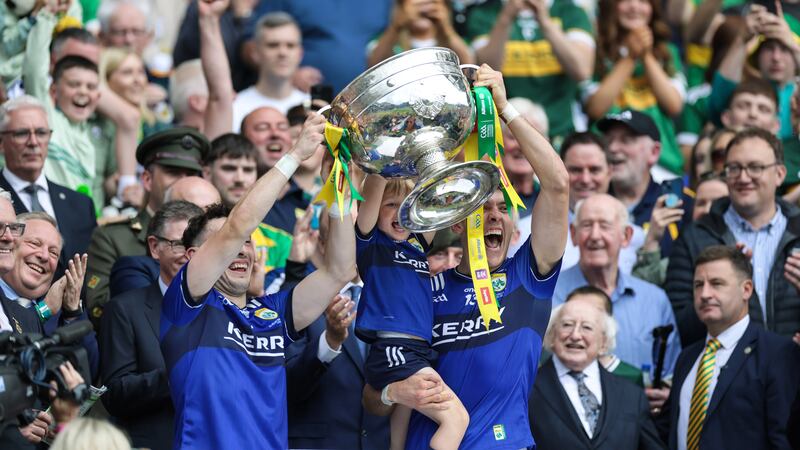 Kerry’s Paudie and David Clifford lift the Sam Maguire Cup. Photograph: Laszlo Geczo/Inpho