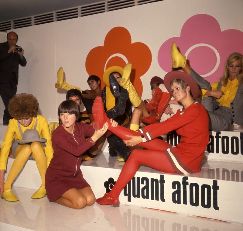 Mary Quant (kneeling) with models showing off her footwear in 1967. Photograph: PA
