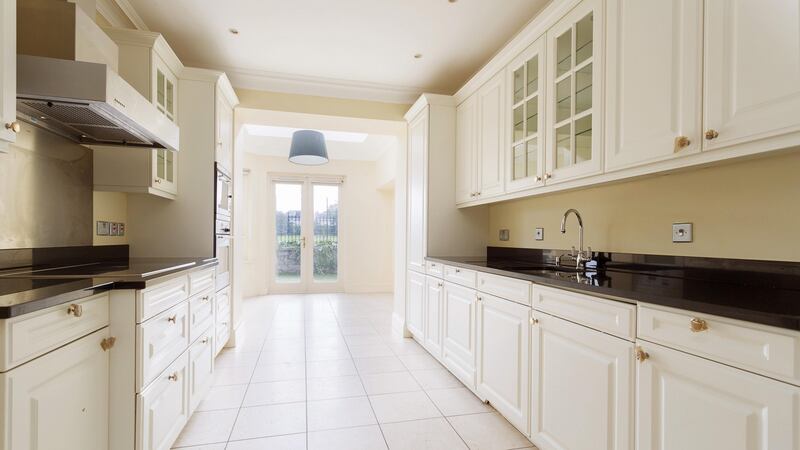 The kitchen, despite being in good condition with Neff appliances, may require some updating.