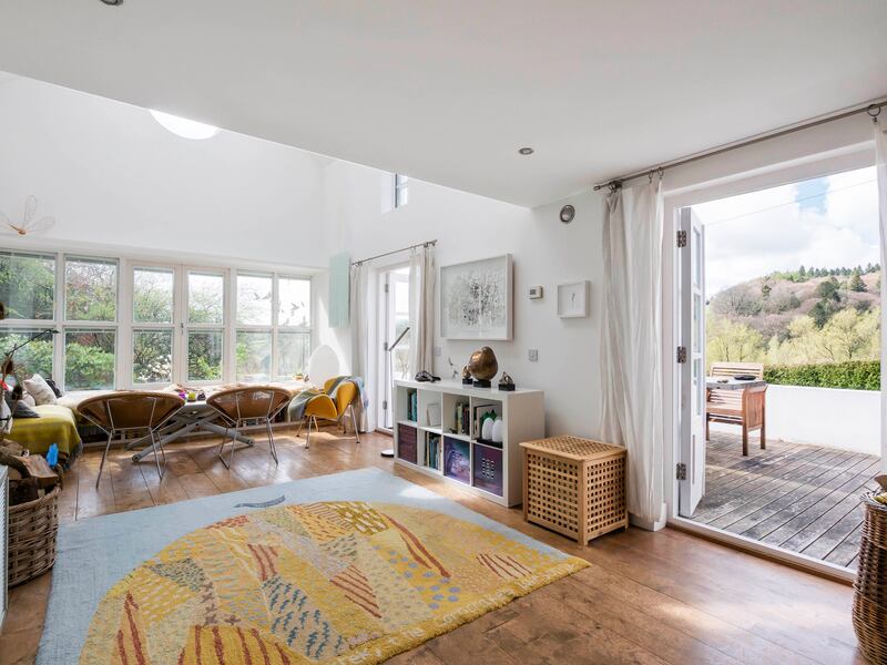 The living room opens out to a deck