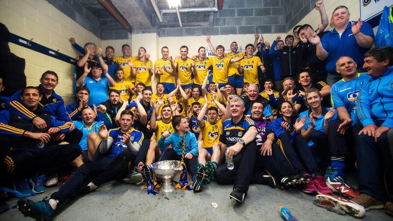 Roscommon celebrate after the game in the changing room with the trophy. Photograph: Inpho