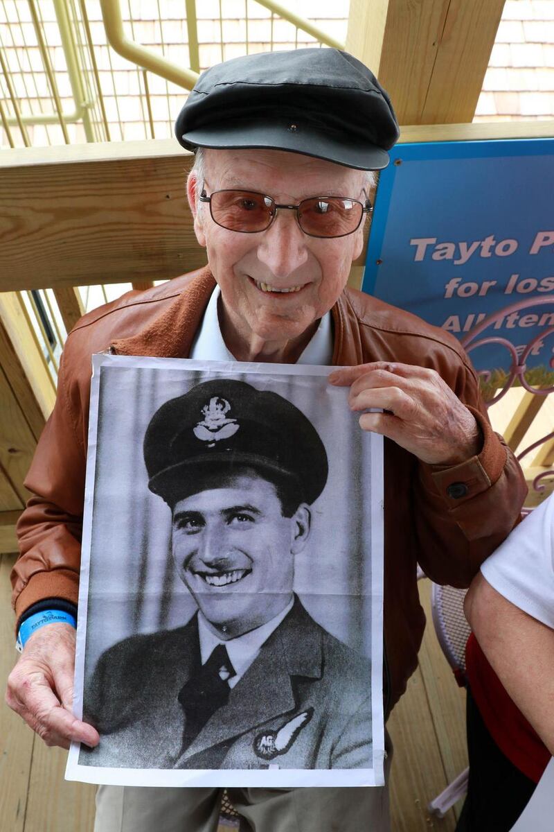 The then 93-year-old former second World War Pilot Ted Veal with a photo from his service days prior to his trip on Tayto Parks ‘Cú Chulainn Coaster’. File Photograph Nick Bradshaw