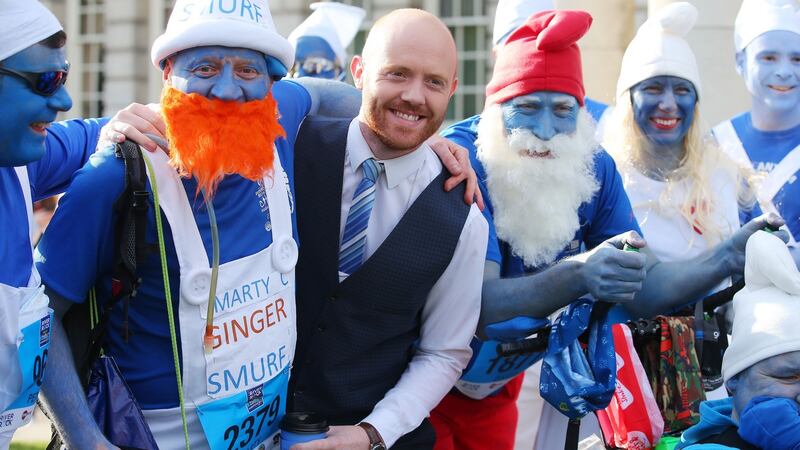 Runners and weatherman Barra Best at the marathon. Photograph: Kelvin Boyes/Inpho