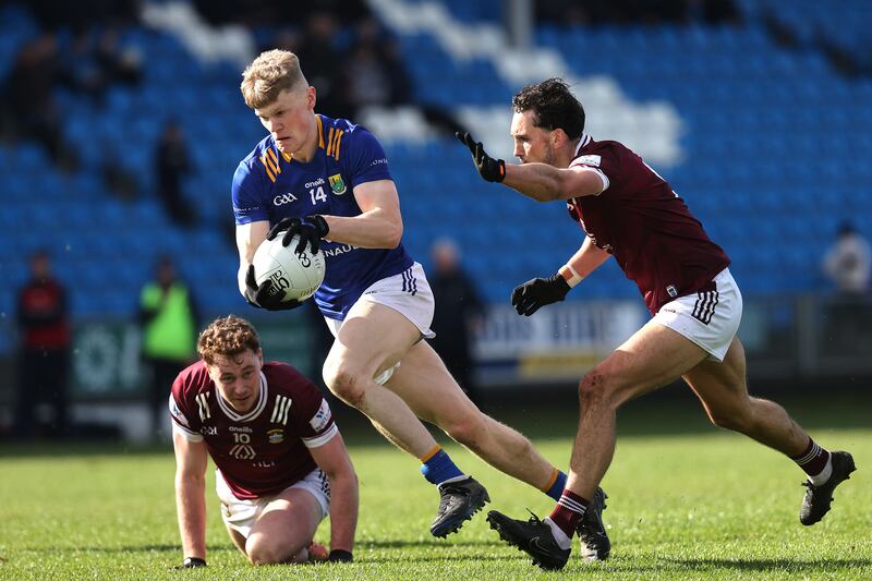 Westmeath's Jonathan Lynam closes in on Kevin Quinn of Wicklow. Photograph: Bryan Keane/Inpho