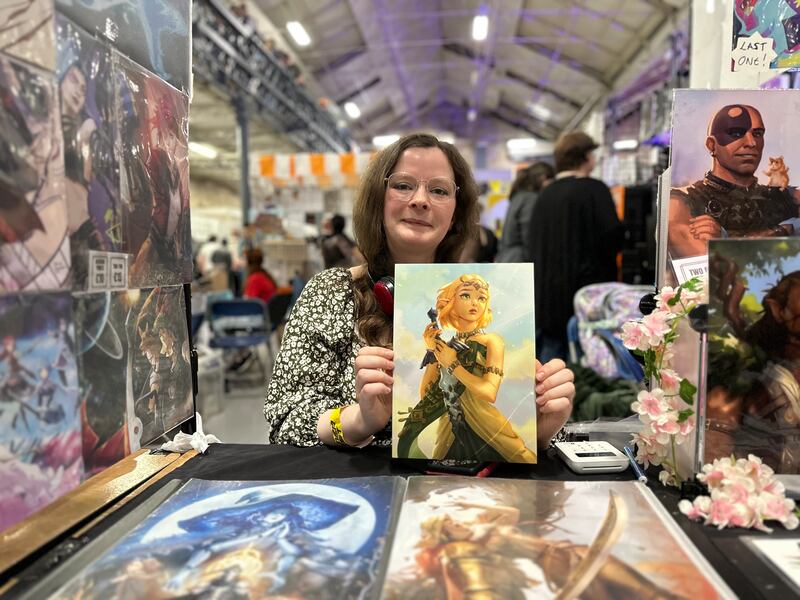 Digital artist Katie O'Kane selling her artwork at GamerFest 2025. Photograph: Conor Capplis