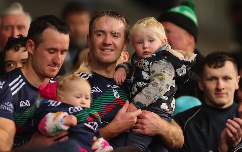 Loughmore-Castleineys’ Noel McGrath celebrates with his son Sam. Photograph: James Crombie/Inpho