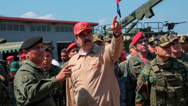 Venezuela’s president Nicolas Maduro speaking to commander during military exercises at the Naval Base Agustin Armario. Photograph: AFP/Getty Images