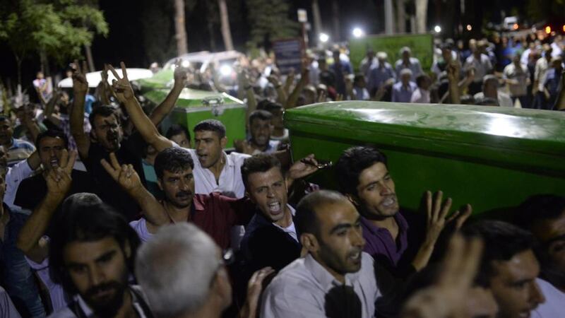 Coffins of victims of a suicide bombing through the streets of Gaziantep following the attack. Photograph: Bulent Kilic/AFP