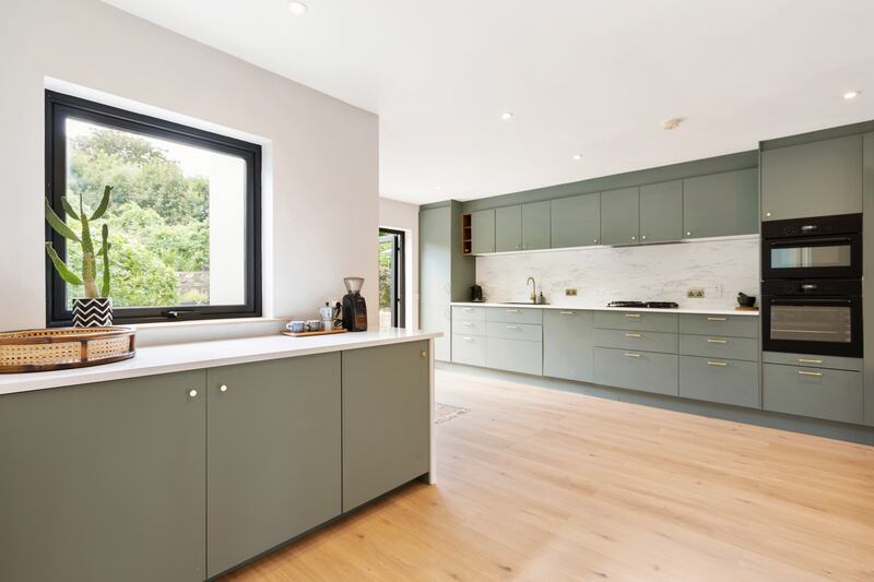 The kitchen is bright thanks to a southwest-facing aspect