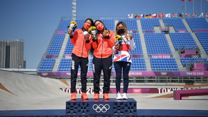 (From left) Silver medallist Japan’s Kokona Hiraki (12), gold medallist Japan’s Sakura Yosozumi (19) and bronze medallist Britain’s Sky Brown (13) pose on the podium. Photo: Loic Venance/AFP via Getty Images