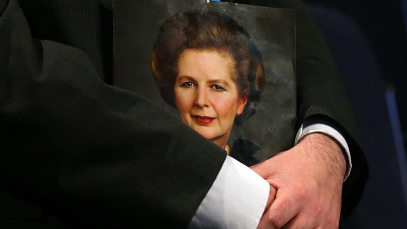 A delegate holds a magazine with a portrait of former British prime minister Margaret Thatcher on its cover, during the first day of the Conservative Party Conference  in Manchester today. Photograph: Dave Thompson/PA Wire