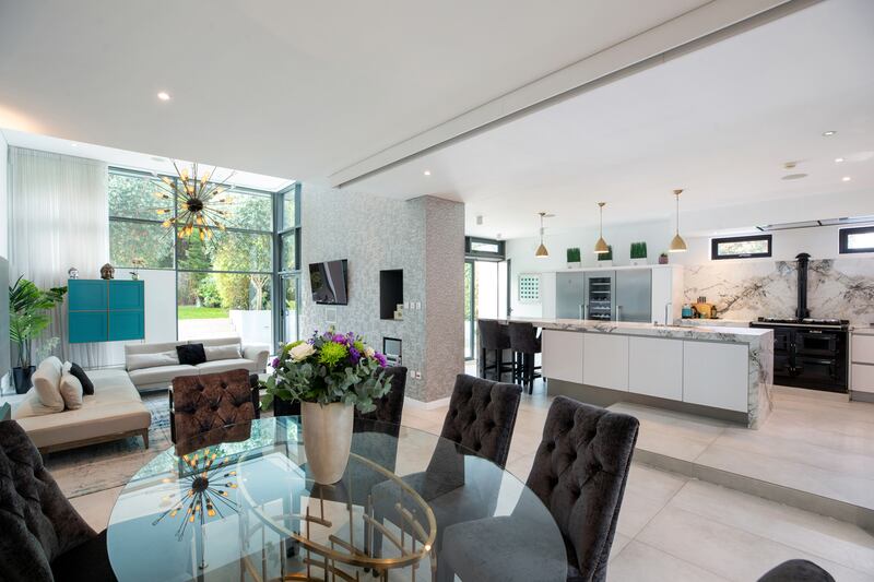 A soaring ceiling over the living area looks out on to the garden through double-height glazing