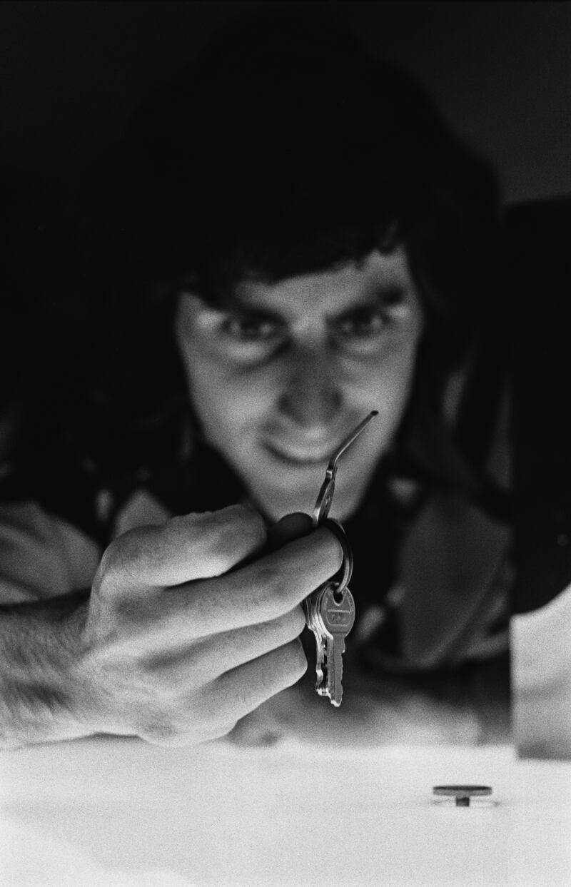 Geller practises his technique on a metal key in 1974.  Photograph: Evening Standard/Hulton Archive/Getty Images