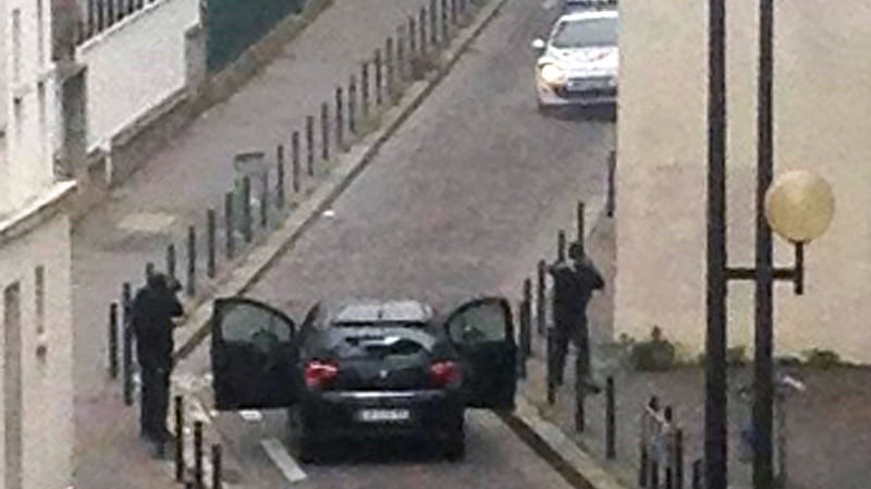 Gunmen face police officers near the offices of ‘Charlie Hebdo’ in Paris on January 7th, 2015, during an attack on the offices of the newspaper. Photograph: Anne Gelbard/AFP/Getty Images