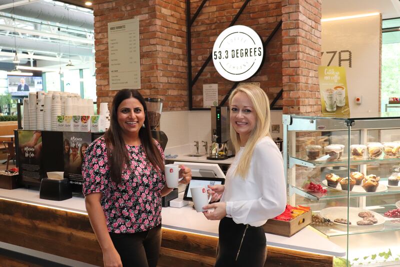 Colleagues Gurwinder Kaur and Mary Dempsey grab a coffee in the on-site Dolmen restaurant 