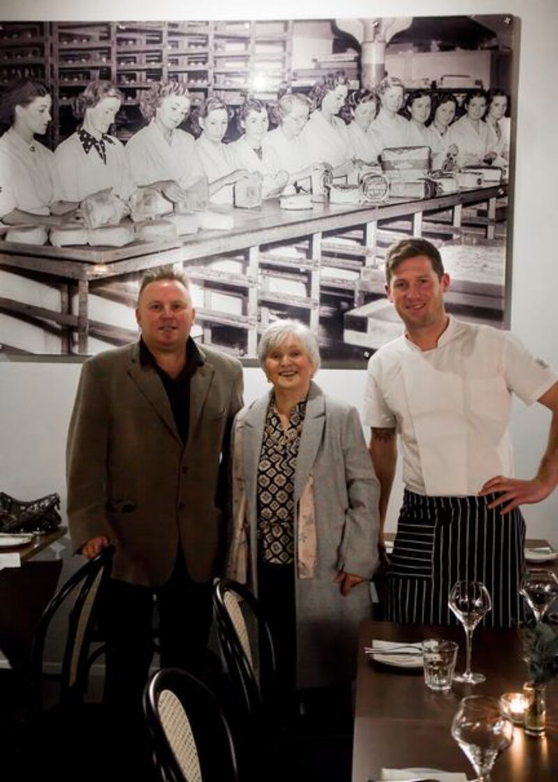 Margaret Dowley, who worked at the Thompson’s Bakery in Cork in the 1950s, pictured in The Glass Curtain restaurant that has opened in the premises, with her son Pat, and chef Brian Murray
