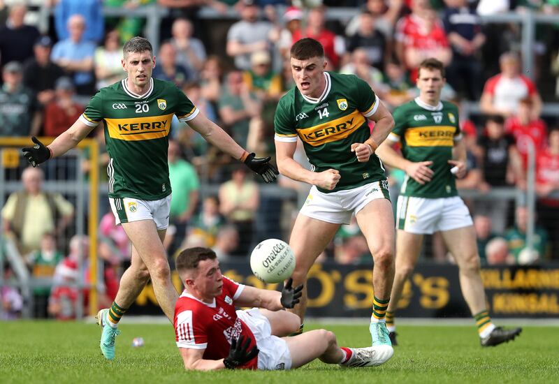 Cork's Luke Fahy and Kerry's Seán O’Shea compete for the ball. Photograph: Bryan Keane/Inpho
