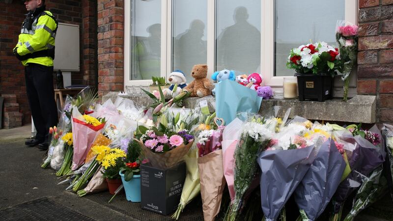 Flowers are seen outside the home of Andrew McGinley and Deirdre Morley following the deaths of their three children. Photograph: Stephen Colllins/Collins.