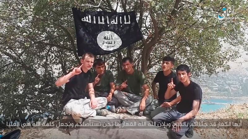 Two days after the cyclists were killed, Islamic State released a video in which these men swore allegiance to the terrorist group. Photograph:  AFP Photo/Amaq News Agency