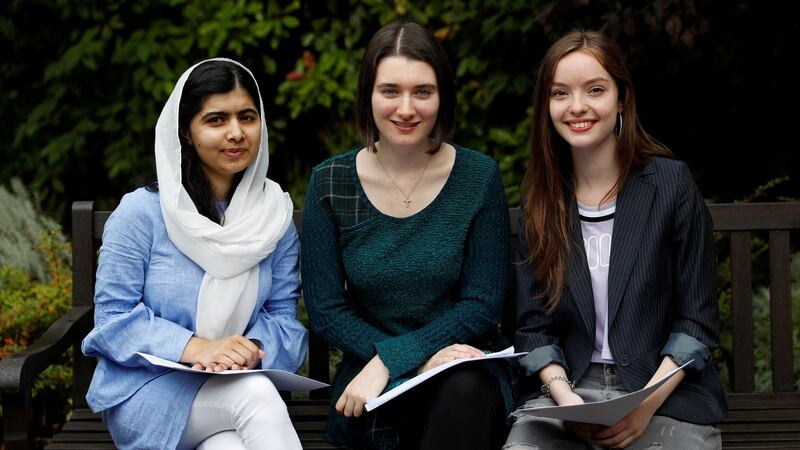 Malala Yousefzai (L) poses with fellow students Bethany Lucas (C) and Beatrice Kessedjian after collecting their A-Level exam results. Photograph: Darren Staples/Reuters