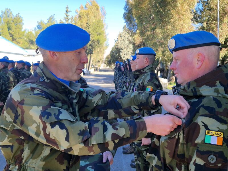 Lieut Col Oliver Clear awarding Undof service medals to members of the 68th Infantry Group at Camp Faouar in the Golan, Syria. Photograph: Conor Gallagher
