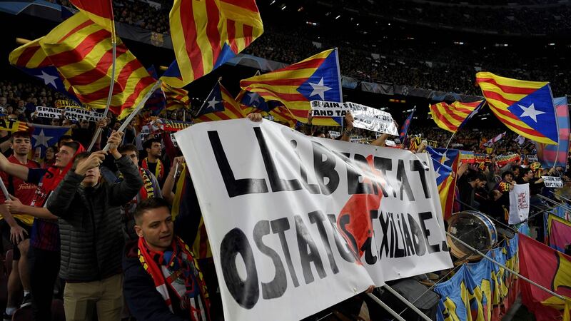 Barcelona’s supporters wave Catalan flags at Tuesday’s Champions League match against Slavia Prague at the Camp Nou stadium. Photograph: Lluis Gene/AFP via Getty Images