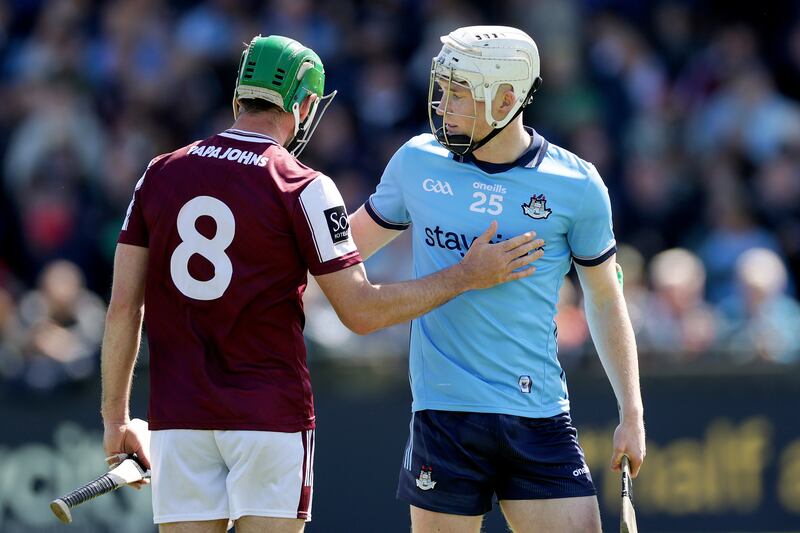 Dublin's Conal Ó Riain shakes hands with Galway's David Burke after the game. Photograph: Laszlo Geczo/Inpho