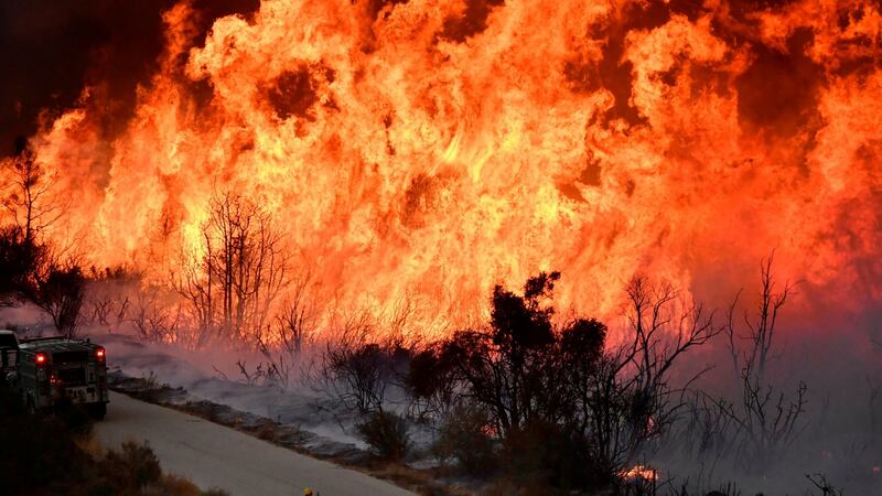 Fire fighters attack the Thomas Fire’s north flank with backfires as they continue to fight a massive wildfire north of Los Angeles, near Ojai , California. Photograph: Gene Blevins/Reuters