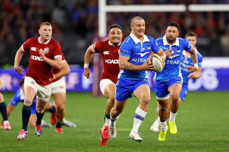Dylan Pietsch of the Western Force runs away from Lions tacklers during the game in Perth. Photograph: James Worsfold/Getty Images