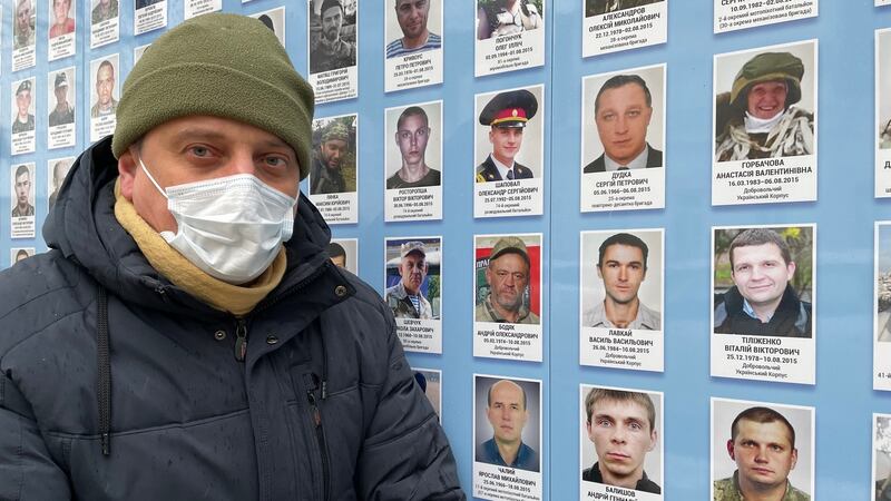 Ukrainian soldier Andriy (48) remembers comrades killed during fighting against Russian-led separatists, at the memory wall of St Michael’s monastery, Kyiv