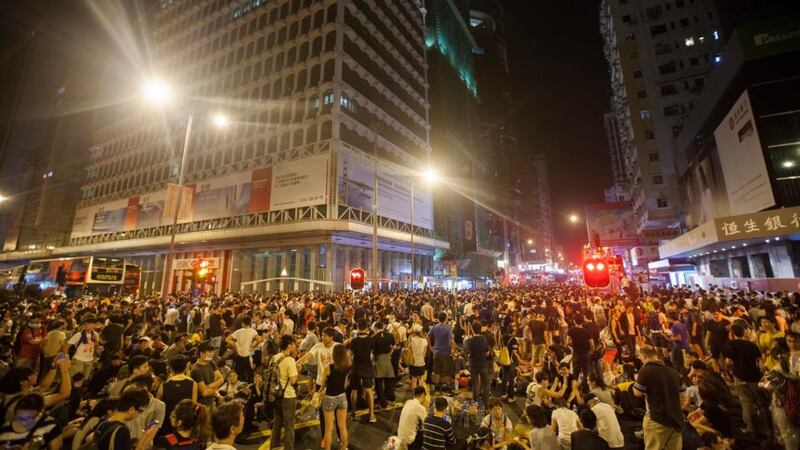 Pro-democracy protesters are seen blocking the busy intersection of Nathan Road and Argyle Street on the first day of the mass civil disobedience campaign Occupy Central, in Hong Kong today. Photograph: EPA